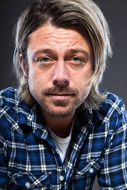 istock Expressive young man with blond long hair and beard. 513535527