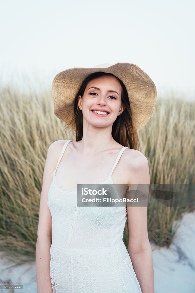 Portrait Of Beautiful Young Woman On The Beach At Sunset 20-24 Years Stock Photo