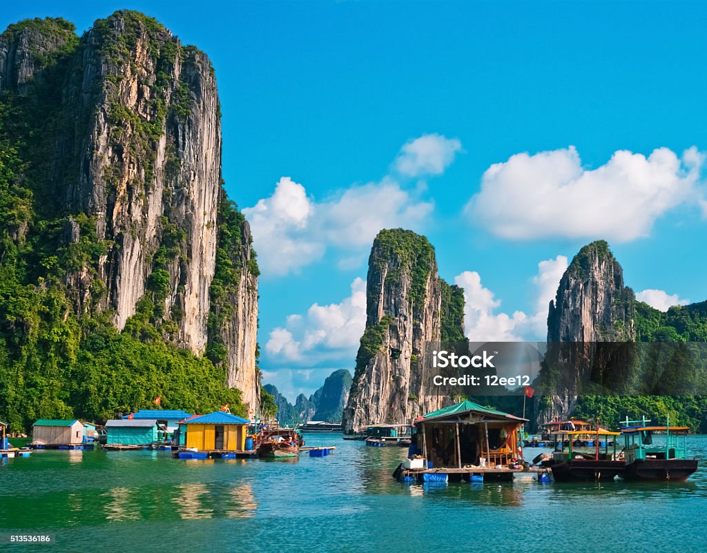 Floating village and rock islands in Halong Bay Floating village and rock islands in Halong Bay, Vietnam, Southeast Asia Hạ Long Bay Stock Photo