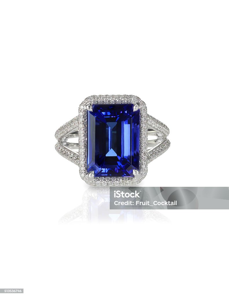 Large emerald cut sapphire engagement ring halo setting pave diamonds Large emerald cut sapphire blue engagement cocktail fashion ring with halo setting and pave diamonds isolated on white with a reflection Sapphire Stock Photo Large emerald cut sapphire engagement ring halo setting pave diamonds Large emerald cut sapphire blue engagement cocktail fashion ring with halo setting and pave diamonds isolated on white with a reflection Sapphire Stock Photo