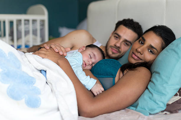 istock Family snuggles in bed 513537110