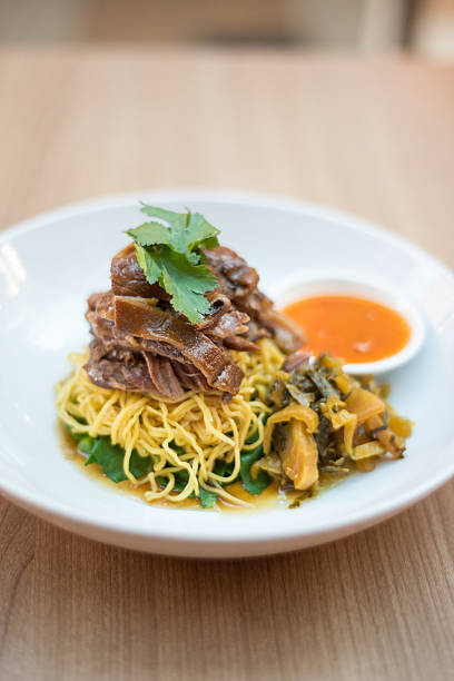 Egg noodles with pork leg stew.