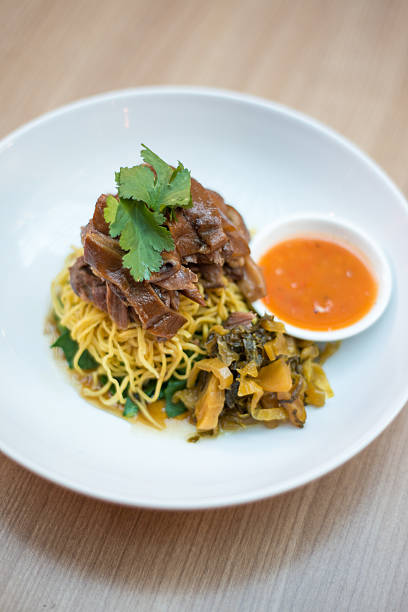 istock Egg noodles with pork leg stew. 513539070