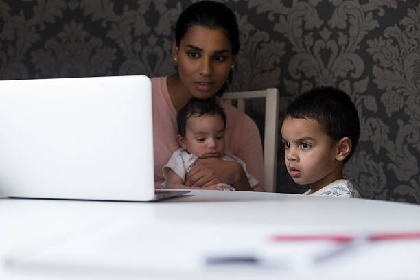 istock Watching cartoons on mums laptop 513540430
