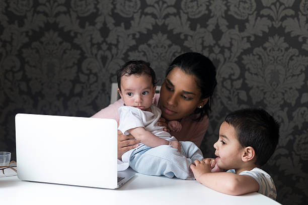 istock Watching cartoons on mums laptop 513540506