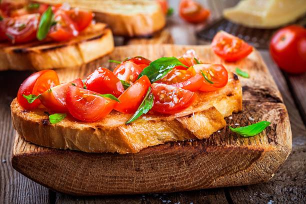 istock homemade bruschetta with cherry tomatoes and basil closeup 513540654