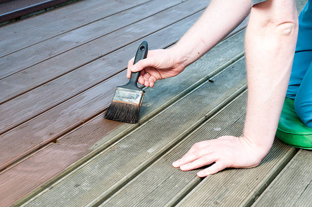 istock Caucasian Man Painting Decking 513540702