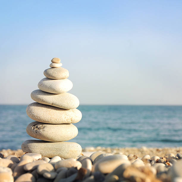 istock Pyramid of stones for meditation lying on sea coast 513540800