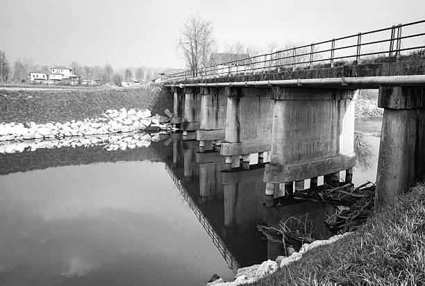 istock Bridge over an irrigation canal. Black and white photo 513543068