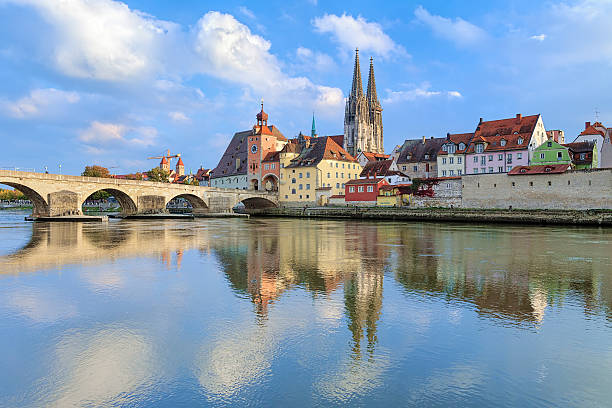 Regensburg Cathedral and Stone Bridge over Danube, Germany View from Danube on Regensburg Cathedral and Stone Bridge in Regensburg, Germany blue danube stock pictures, royalty-free photos & images