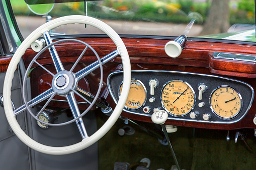 dashboard and steering wheel of a vintage convertible car