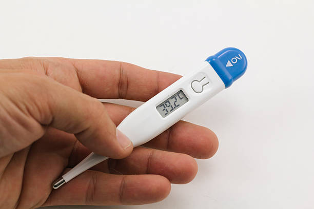 Thermometer in fever stock photo