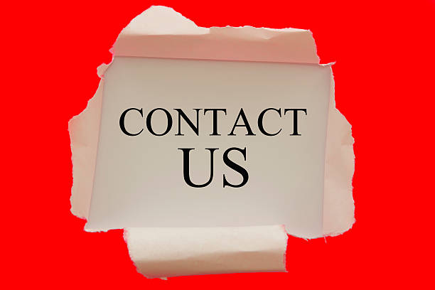 istock Contact us word written under red torn paper 513548472