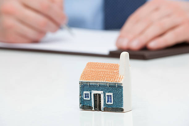 istock Businessman planning a purchase a house 513550840