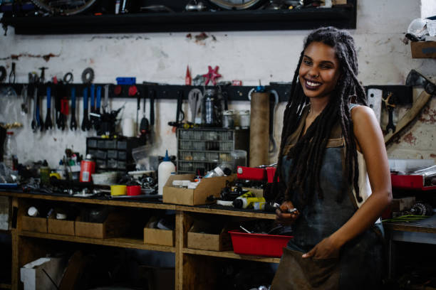 istock Afro craftswoman standing in her workshop with her tools 513551738