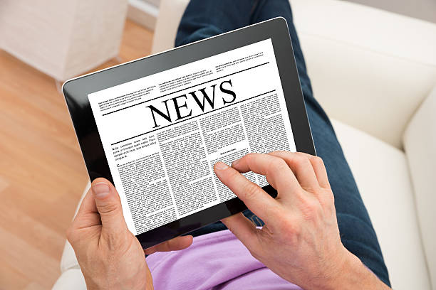 istock Man Reading News On Digital Tablet 513553094