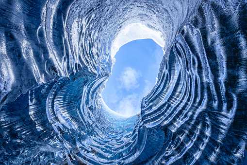 Looking up through a opening in a glacier cave in Iceland