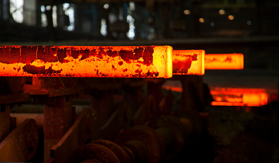 hot steel slabs on metallurgical plant conveyor