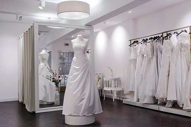 Bridal shop, store, mannequin and large mirror, changing room Changing room at a bridal shop, mannequin and large mirror bridal shop photos stock pictures, royalty-free photos & images