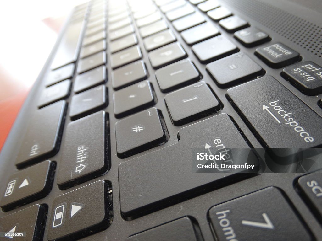 Laptop Keyboard focus on enter key Laptop keyboard for business websites and powerpoints, with focus on enter key. Business Stock Photo