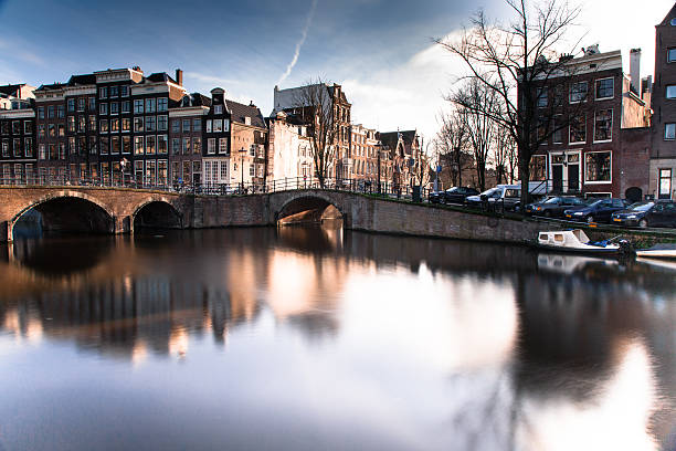 istock Amsterdam Netherlands canal in city 513566499
