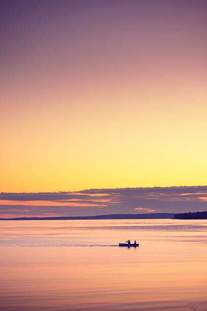 istock Men in Rowing Boat at Dusk 513568057