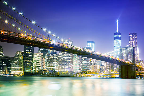 istock New York Skyline With Brooklyn Bridge at Night 513568419