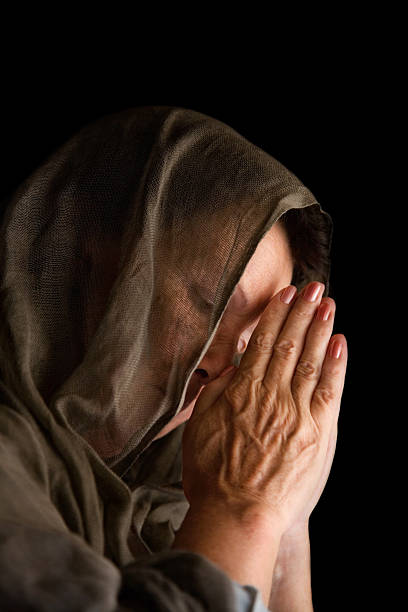 istock Woman praying with hands 513568819