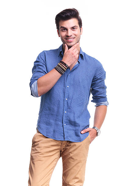 istock young pensive casual man smiling 513570483