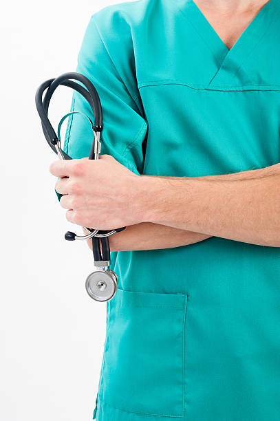 istock Male nurse with a stethoscope in the hands 513571233