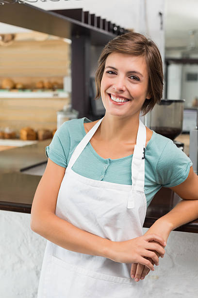istock Pretty barista smiling at camera 513571441