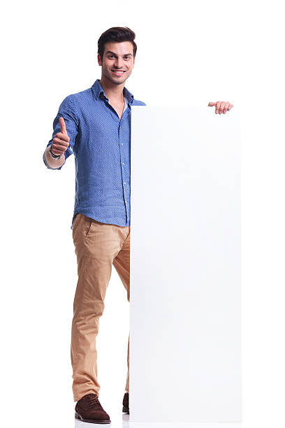 istock man presenting a big board and makes the ok sign 513571479