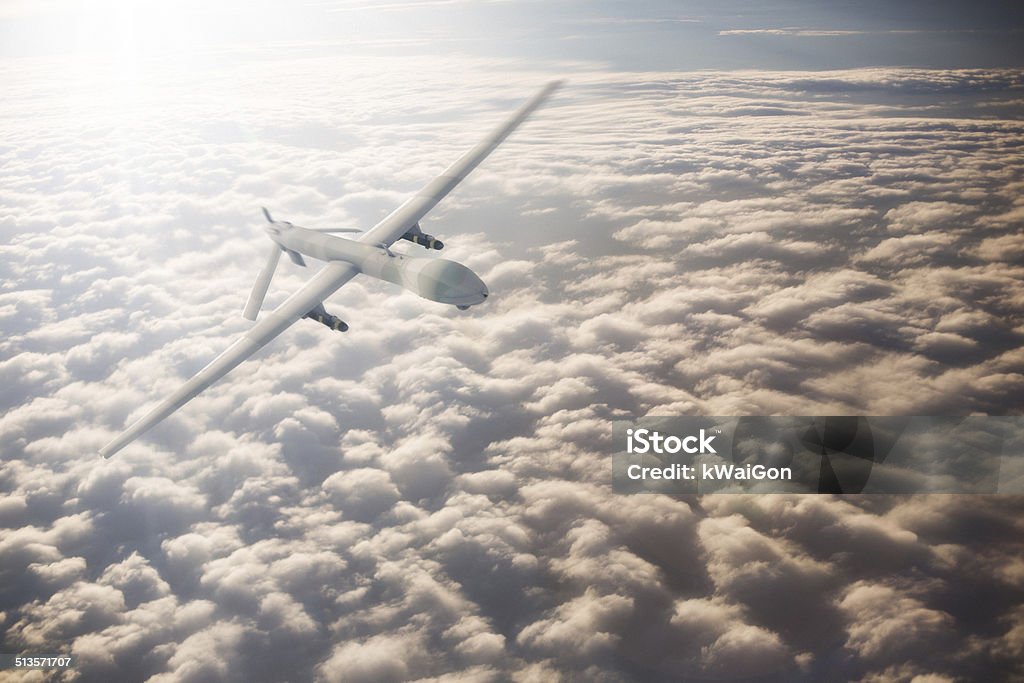 UAV Drone Flying UAV Drone shown above the clouds Drone Stock Photo