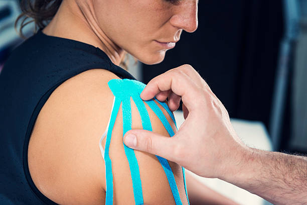 istock Kinesio tape shoulder treatment 513572061