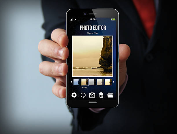 businessman with photo editor smartphone modern photography concept: businessman holding a photo editor smartphone photo editor photos stock pictures, royalty-free photos & images