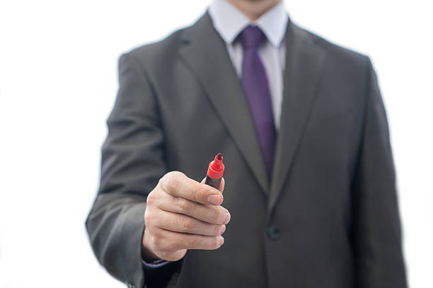 writing markers The manager or the teacher writing on the glass man writing on white board stock pictures, royalty-free photos & images