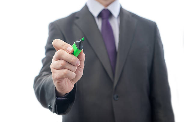 writing hand The manager or the teacher writing on the glass man writing on white board stock pictures, royalty-free photos & images