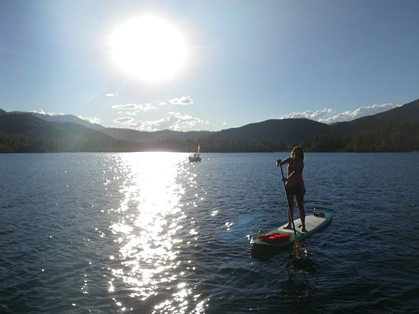 istock Woman On Paddle Board Sunny Day 513583398