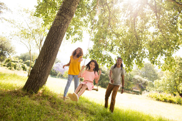 istock Stunning young mom and dad pushing their beautiful daughter 513583818