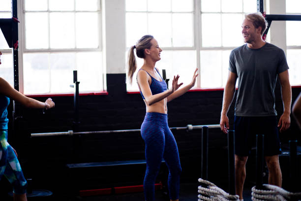 istock Friends talking and joking during a break at the gym 513585014