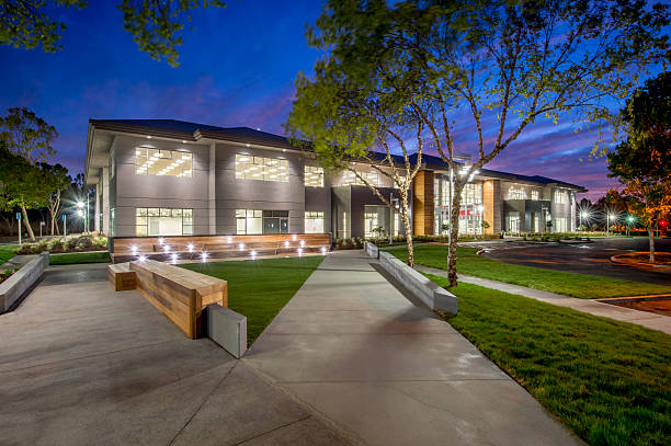 Office Building, Night Upscale office building at dusk. office park stock pictures, royalty-free photos & images