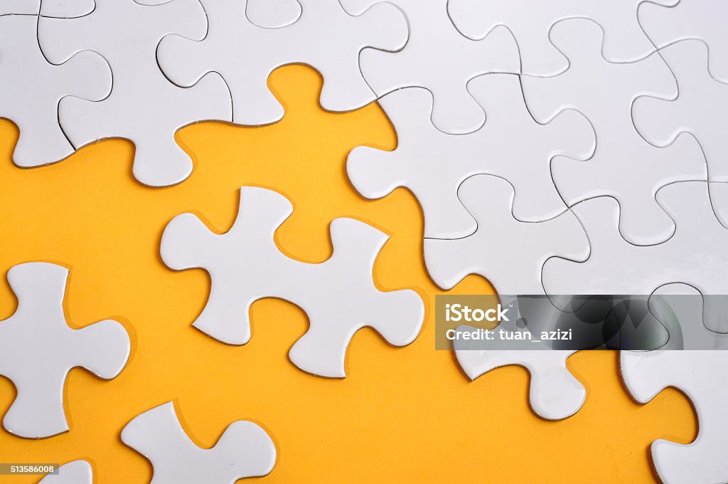 Missing Puzzle on Yellow Background, Searching a Solution Concept Missing Puzzle on Yellow Background, Searching a Solution and Business Concept Jigsaw Puzzle Stock Photo