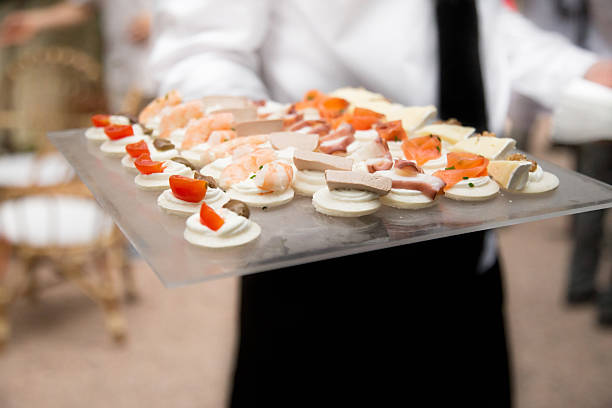 istock Waiter carrying  appetizers and finger food 513587104