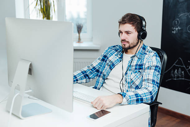 istock Despaired boy in front of the computer 513589328