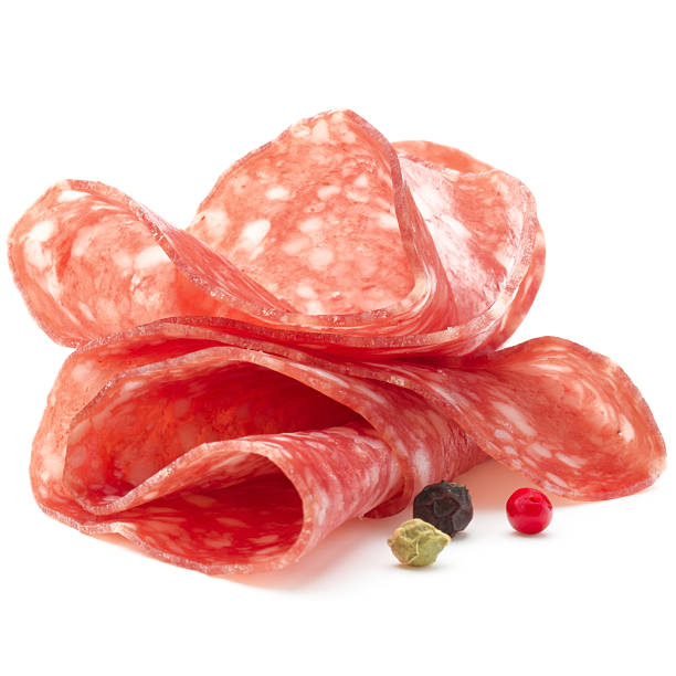 Salami sausage slices isolated on white background cutout Salami sausage slices isolated on white background cutout salami stock pictures, royalty-free photos & images