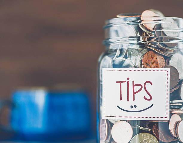 istock Tip jar in coffee shop or restaurant. American currency 513592304