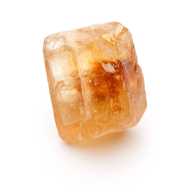 istock Brown caramelized lump cane sugar cube isolated on white backgro 513592374