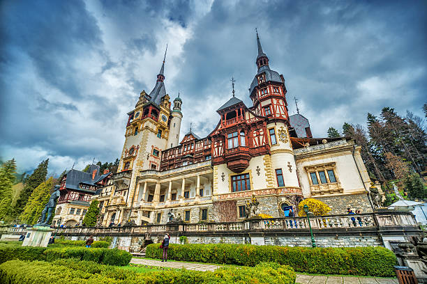Sinaia, Romania - April 19, 2014: The Peles Castle, a Neo-Renaissance castle in the Carpathian Mountains, near Sinaia, Romania. It served as a royal summer retreat. It was built between 1873 and 1914. for King Carol I of Romania. Its inauguration was held in 1883.