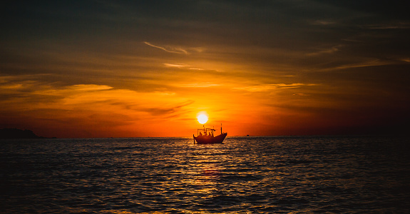 Beautiful seascape about sunrise on the sea with fishsing boat in Khanhhoa province, Vietnam