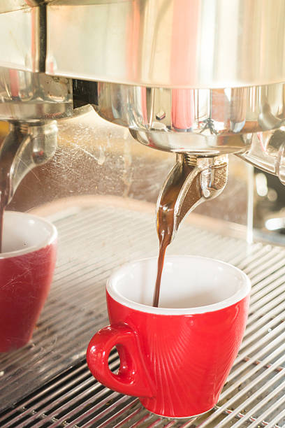 istock Fresh brewing hot coffee from espresso machine with vintage filt 513595468